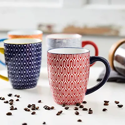 Mugs and cups: one shelf, several printed lines.